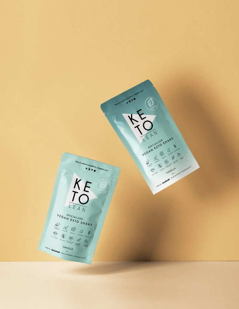 Two packets of keto on a yellow background.