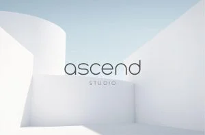 A white building with the word ascend studio on it.
