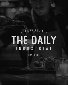 The daily industrial is a black and white photo of a bartender.